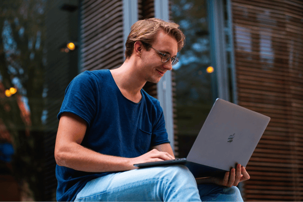 person holding a laptop