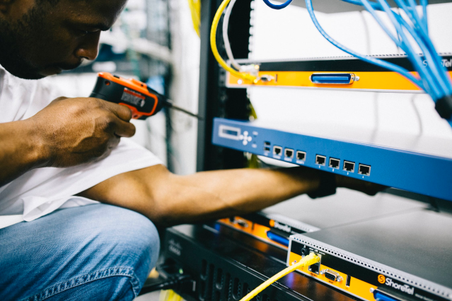 Man installing cabinet racks