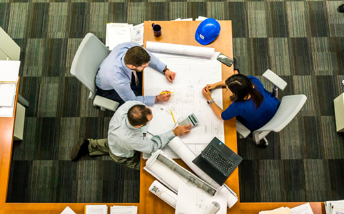 Overhead view of people working on a table